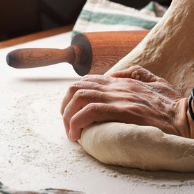TUSIWIT rolling pin on dough demonstrates even thickness and precise control.