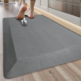Tyrot anti-fatigue kitchen mat on grey floor provides cushioned comfort for cooking
