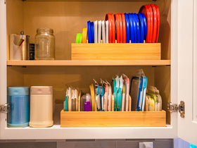 Umilife organizer features 11 slots and 5 adjustable dividers for lid organization.
