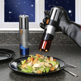 Uncanny Brands Star Wars Lightsaber salt pepper mills pack 2, side view, one-handed operation for easy seasoning.