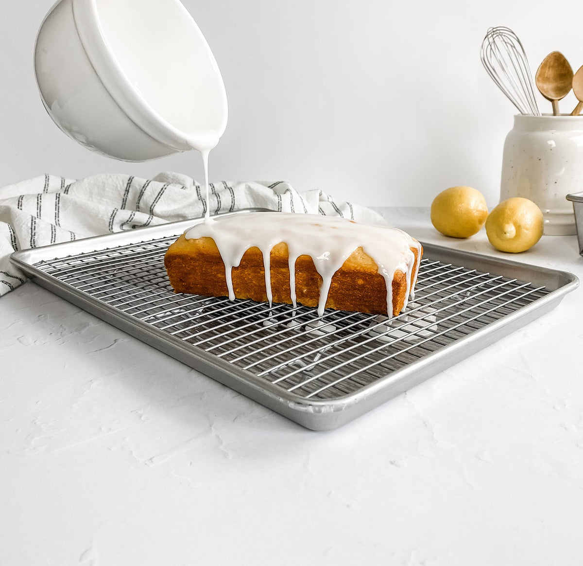 Cookies baking on USA Pan half-sheet pan with even browning.