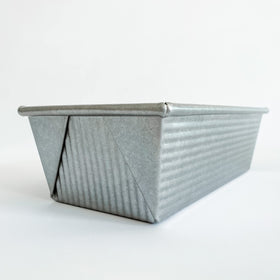 USA Pan loaf pan ridged surface improves air circulation for even baking.