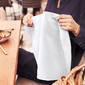 Utopia Home hemmed-edged napkins provide a polished look on the table.