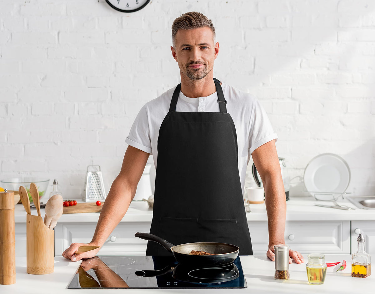 Two-pack display showing black and white bib aprons for versatile looks.