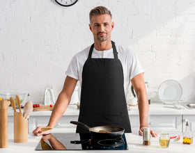 Two-pack display showing black and white bib aprons for versatile looks.