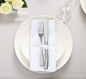 Hotel table arrangement featuring Utopia Kitchen napkins.