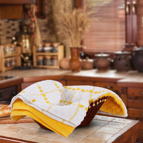 Utopia Towels stacked on the counter show vibrant yellow color