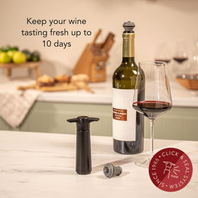Vacu Vin pump-action air remover in use to extract bottle air