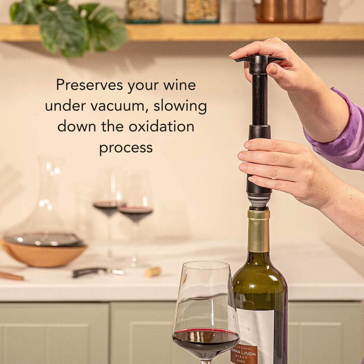 Vacuvin Original Wine Saver in use on a bottle to retain wine aroma.