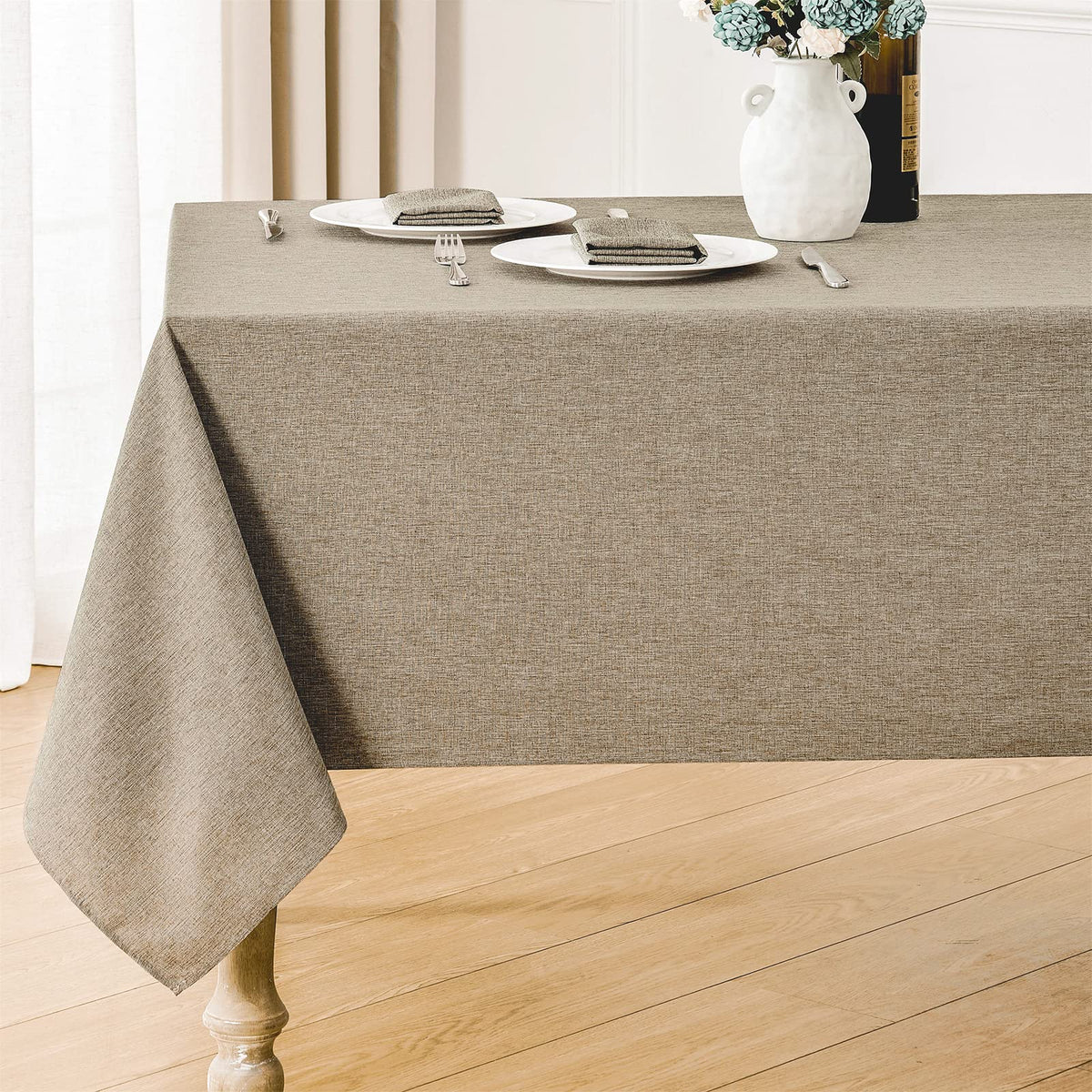 Veblandy rectangle tablecloth with mocha texture enhances dining ambience.
