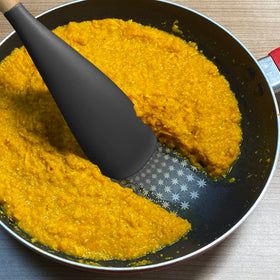 VOVOLY black silicone spoon, great for mixing, scooping, and serving.