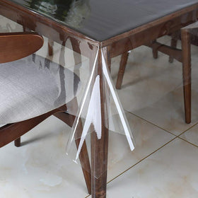 Walrus Clear Vinyl Tablecloth Protector, transparent shield guarding the dining table from spills.
