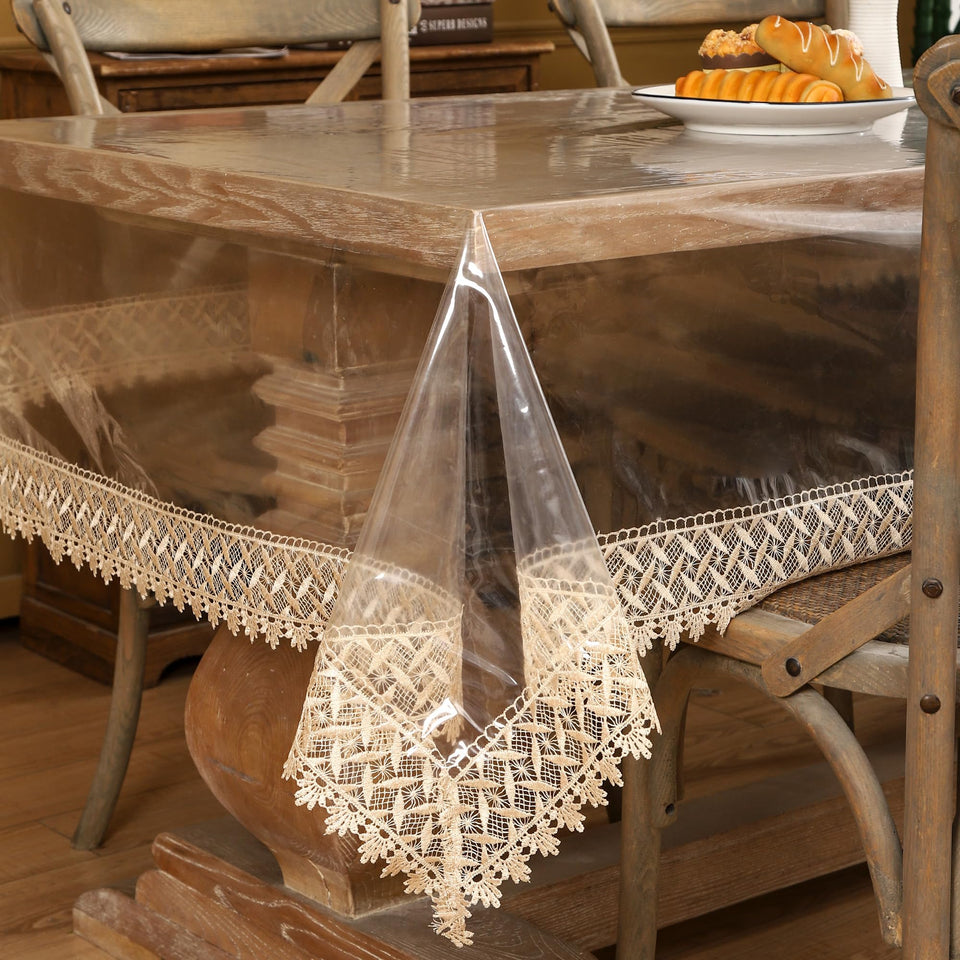 Walrus clear vinyl tablecloth protector with lace edge keeps surfaces clean and stylish.