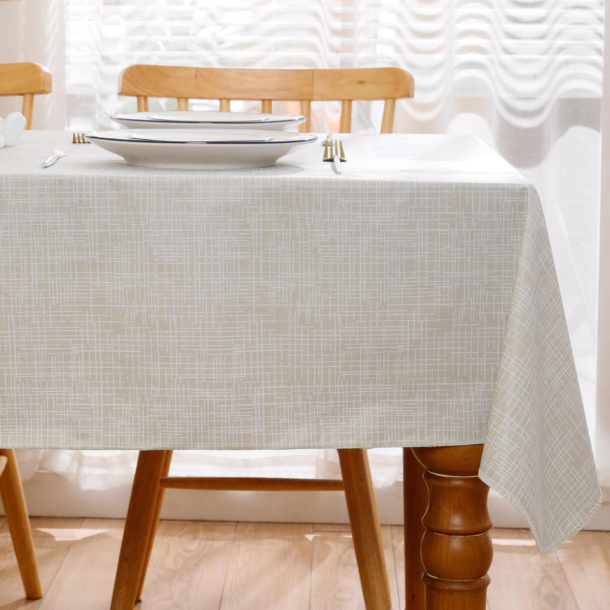 Walrus flannel-backed beige-striped tablecloth adds warm, classic style to meals.
