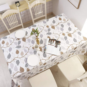 Walrus leaves pattern tablecloth on outdoor picnic setup.