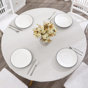 Walrus round vinyl fitted tablecloth showing waterproof protection for dining surfaces