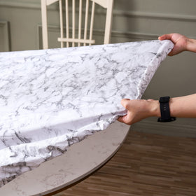 Walrus round tablecloth resists stains and oils, preserving your table's look