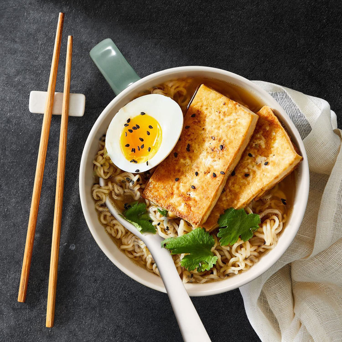 Wareland ceramic soup spoon enhances scooping and tasting.