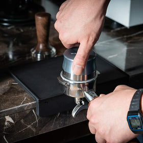 Watchget Portafilter Mat protects counters during tamping.