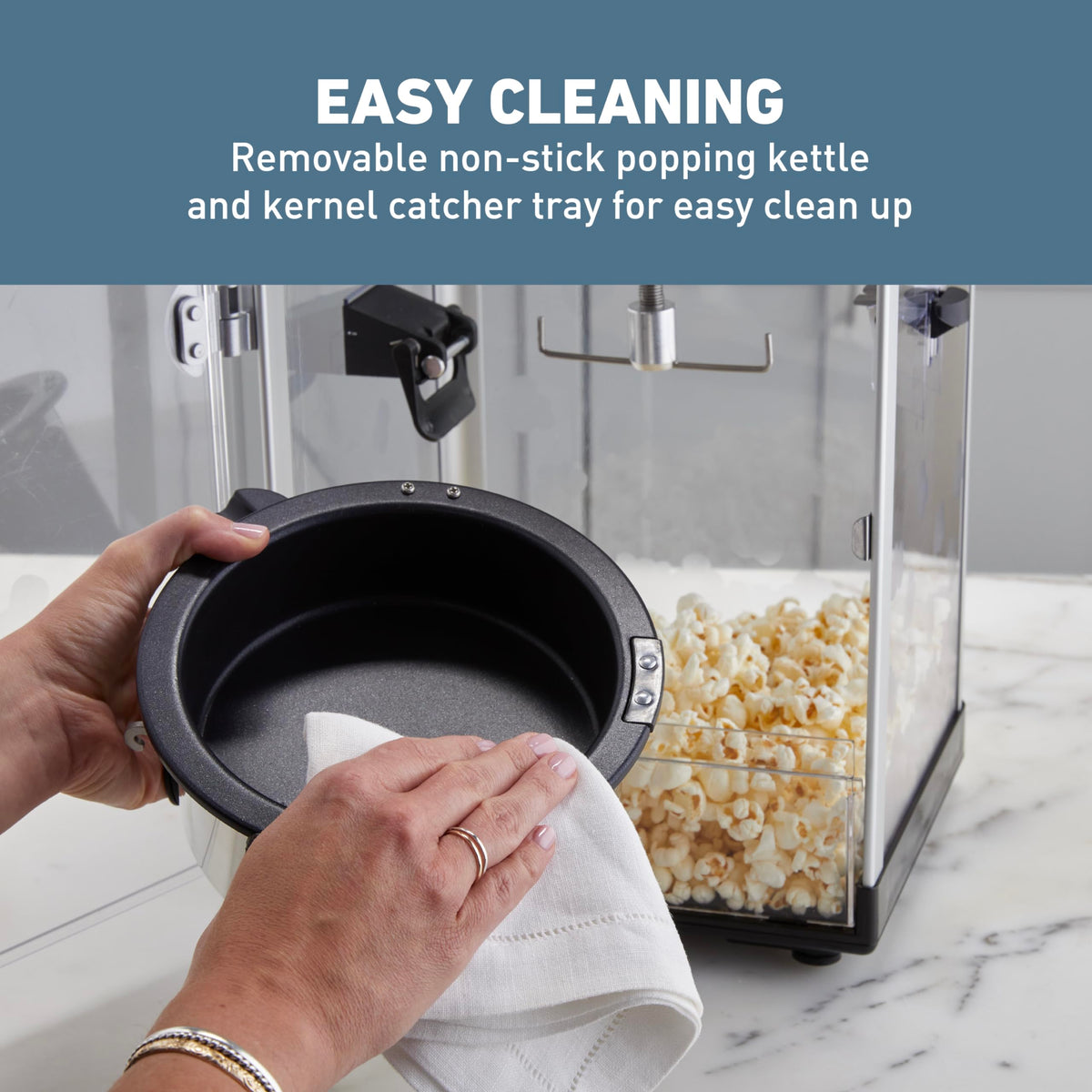 West Bend Stir Crazy Popcorn Maker removable kernel catcher tray for easy cleanup.