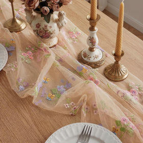 Windkream embroidered floral motifs elevate table decor.