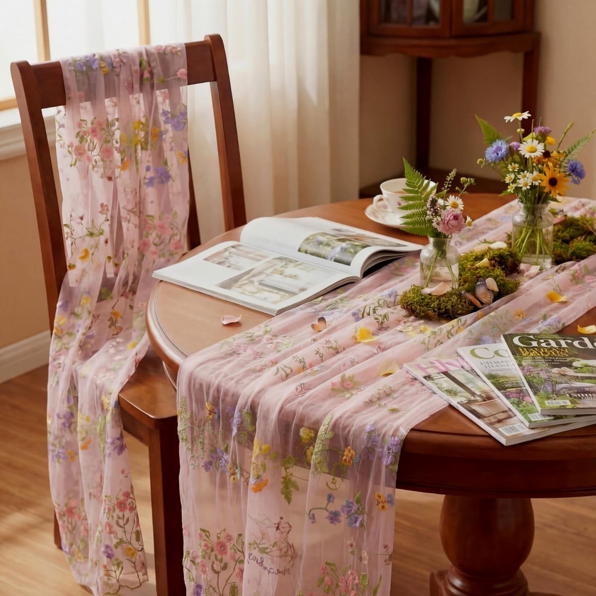 Windkream pink floral table runner on a long dining table for weddings.