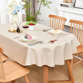Wolkemer Farmhouse faux linen oval tablecloth on a dining table, enhancing rustic elegance and spill protection