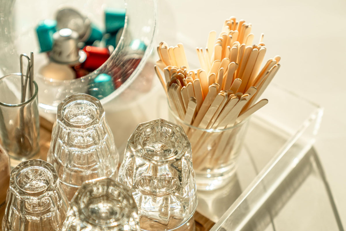 Woodable disposable coffee stirrers streamline cleanup after service.