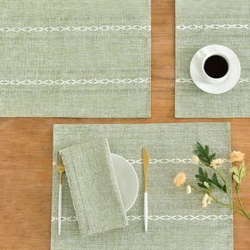 Wracra placemats feature a textured weave for table elegance.