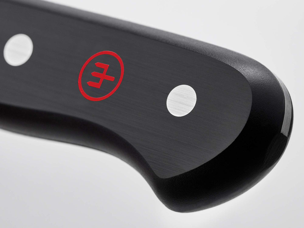 Wüsthof Gourmet 3-inch spear point in action peeling fruit with control.