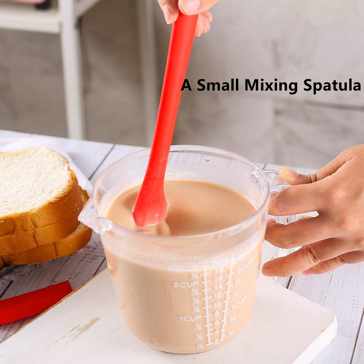 Yoku Made silicone spatula 10-inch handle — reaches deep into containers.