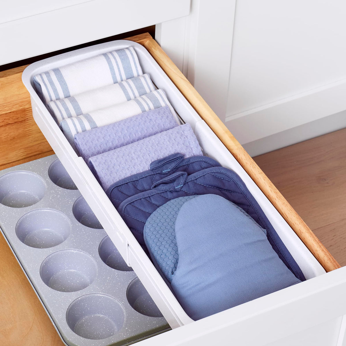 YouCopia DrawerFit bin glides smoothly, offering easy access to items stored below.