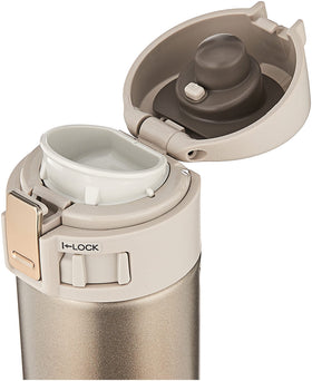 Zojirushi champagne gold mug lid closeup highlights secure flip lid and spill prevention.